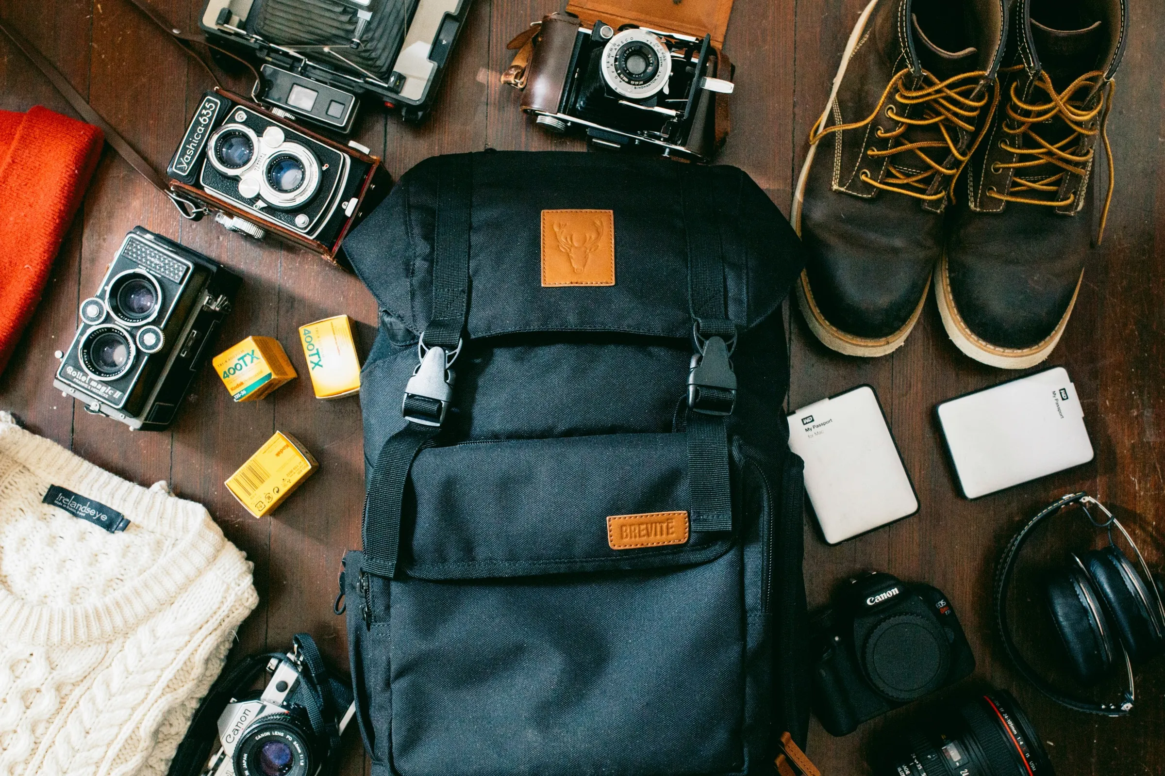 Travel camera gear laid out flat