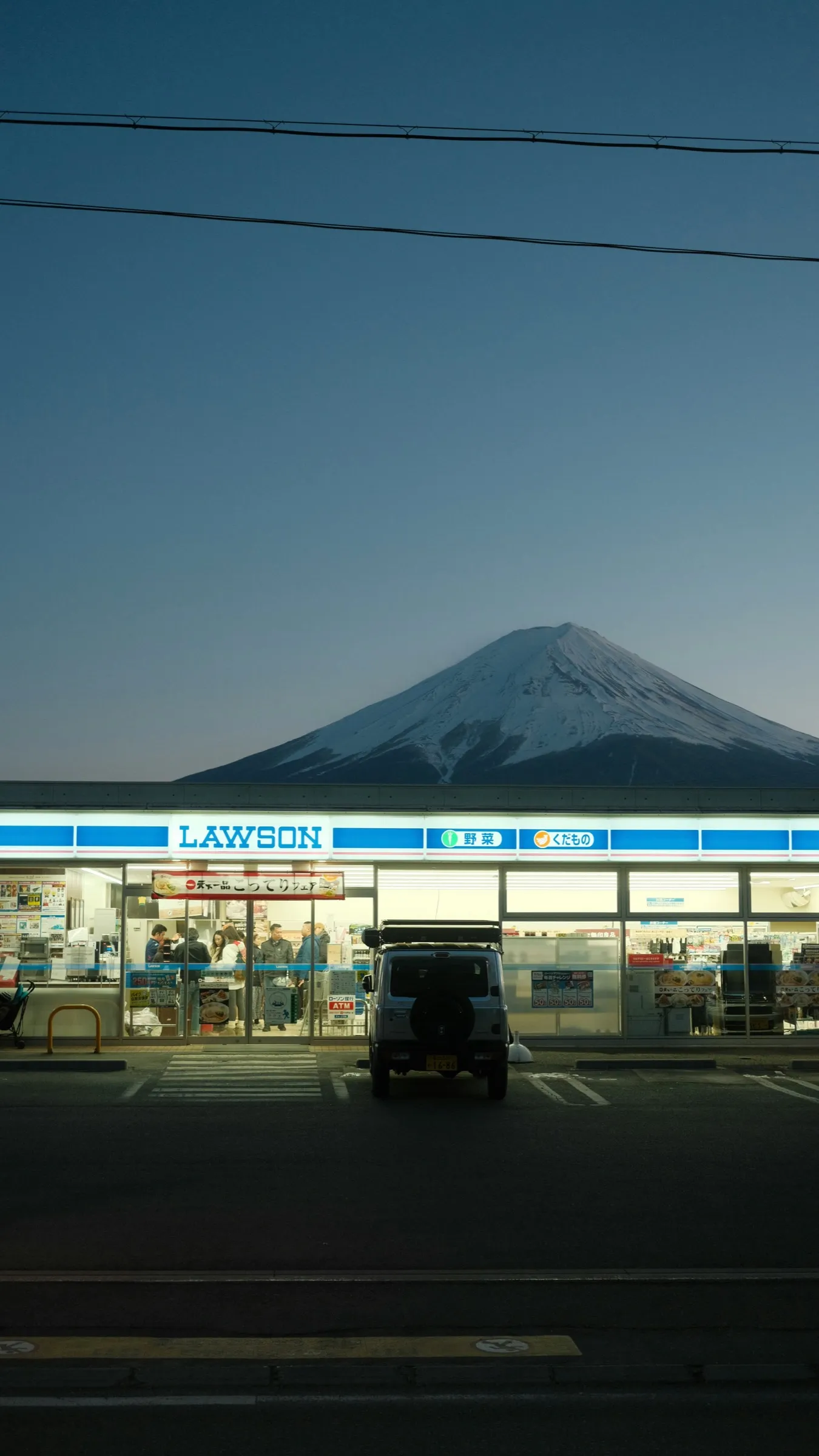 A Lawson convenience store with Mt. Fuji in the background